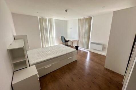 Bright and spacious master bedroom featuring a ...