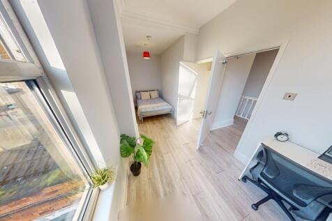 A bright and clean hallway with ample natural l...