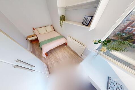 A bright and tidy single toilet room with moder...