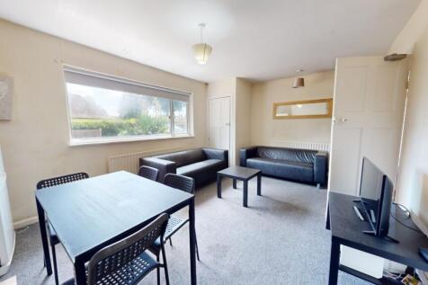 Bright and welcoming living room featuring a la...