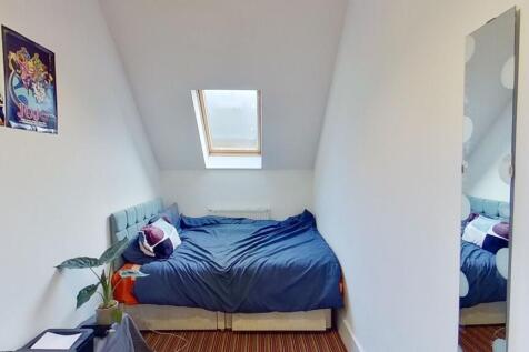 Bright and cozy double bedroom featuring a comf...