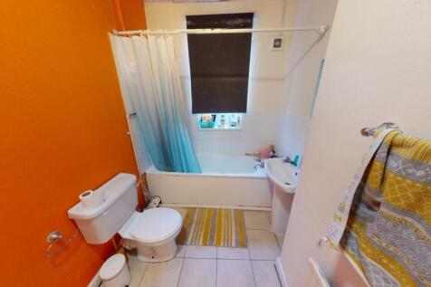 A bright and inviting bathroom suite featuring ...