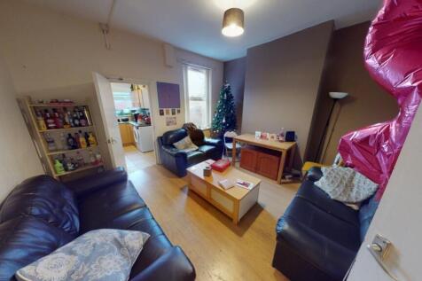 A cozy living room featuring comfortable leathe...