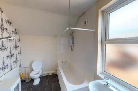 Bright and well-maintained bathroom featuring a...