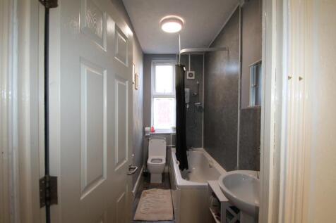 Bright and functional bathroom featuring a bath...