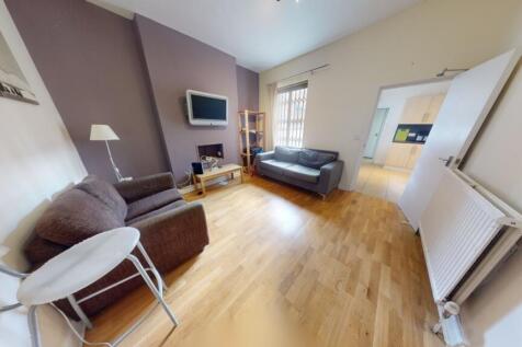 A bright and welcoming living room featuring a ...