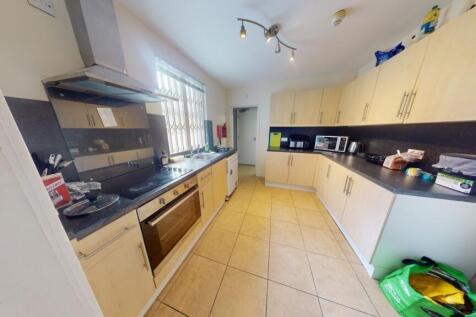 Bright and spacious kitchen featuring ample cou...