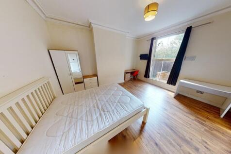 Bright and airy double bedroom featuring a larg...