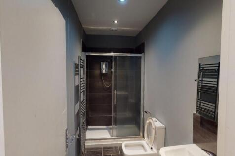 A modern and well-maintained bathroom suite fea...