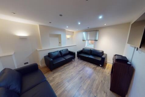 A comfortable communal lounge featuring three b...
