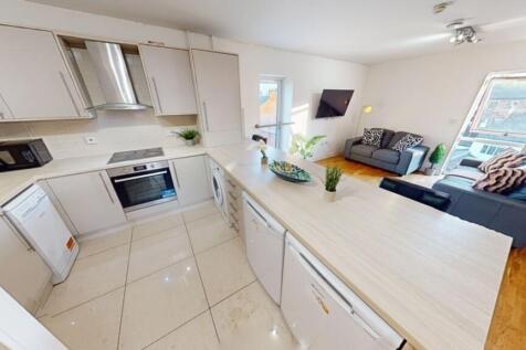 A bright and modern open-plan living room with ...
