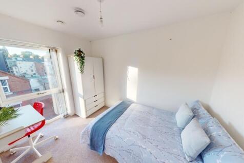 Bright and airy double bedroom featuring a comf...