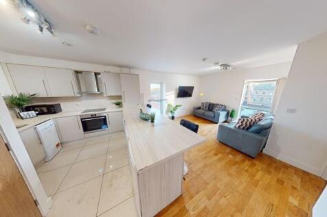A bright and modern kitchen with ample counter ...