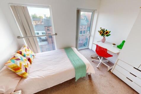 Bright and cozy single bedroom featuring a comf...
