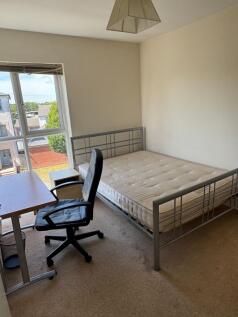 Bright double bedroom with large window offerin...