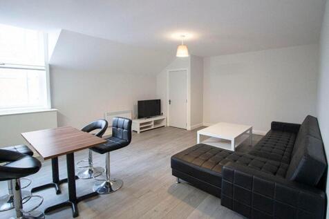 A bright and spacious living room featuring mod...