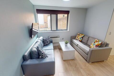 A modern living room featuring two comfortable ...