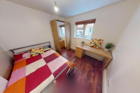 A bright and inviting double bedroom featuring ...