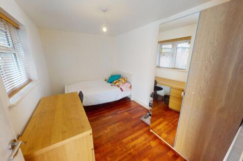 A bright and spacious double bedroom featuring ...
