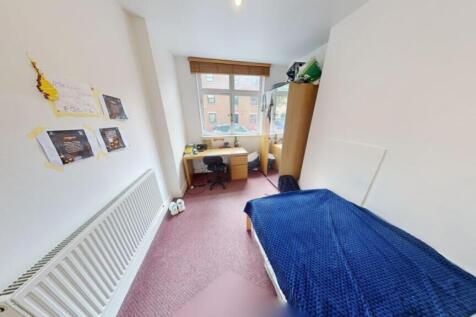 A bright and tidy double bedroom featuring a wo...