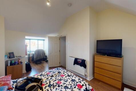 Bright and spacious master bedroom featuring a ...