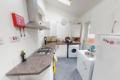 Bright and tidy kitchen featuring modern applia...