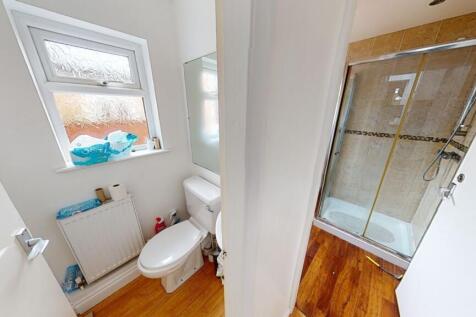 A bright and clean bathroom featuring a spaciou...