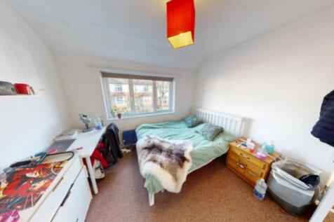 A bright and inviting double bedroom with ample...