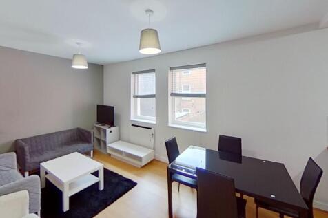 Bright and welcoming living room featuring a co...