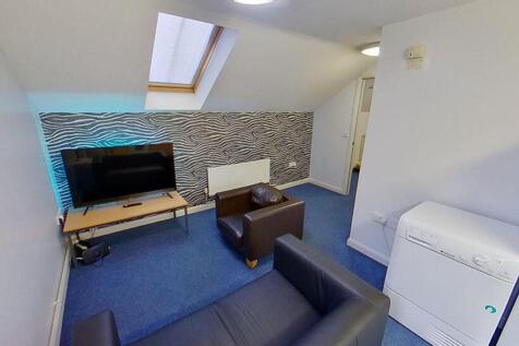 A stylish and cozy living room featuring contem...