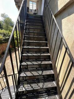 A well-maintained outdoor metal staircase with ...