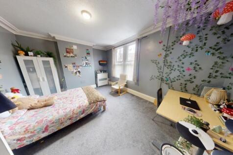 Bright and inviting master bedroom featuring a ...