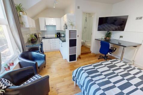 Bright and spacious master bedroom featuring a ...