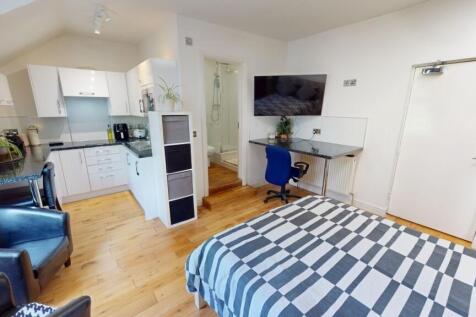 Spacious and bright master bedroom featuring a ...