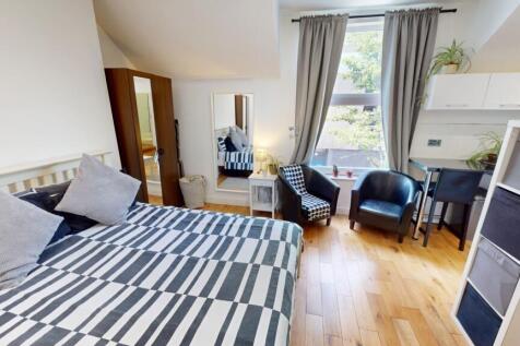 A bright and inviting double bedroom featuring ...