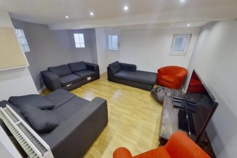A spacious and inviting modern living room, per...