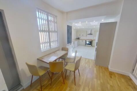 A spacious and bright kitchenette area, perfect...