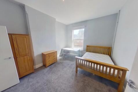 A bright and spacious double bedroom with ample...