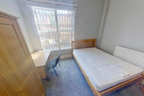 A bright and inviting double bedroom with natur...