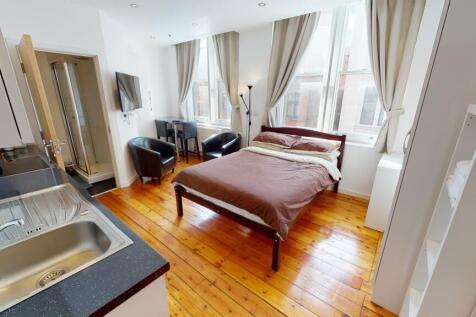 Bright and spacious master bedroom featuring a ...
