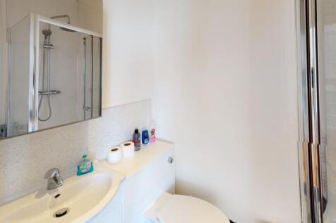 Bright and clean bathroom featuring a modern si...