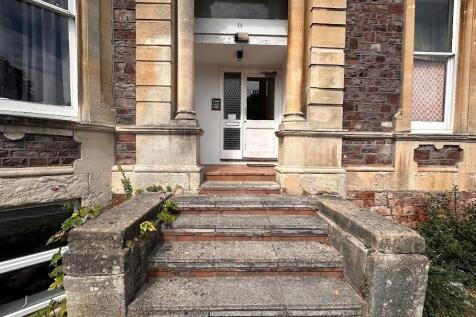 A charming entrance to a traditional stone and ...