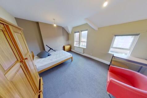 Bright and cozy double bedroom featuring a larg...