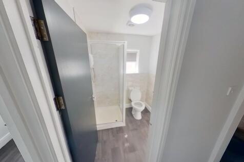 Bright and modern bathroom featuring a clean wh...