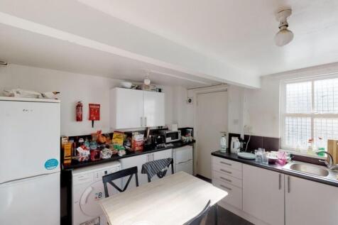 Bright kitchen featuring ample counter space, m...