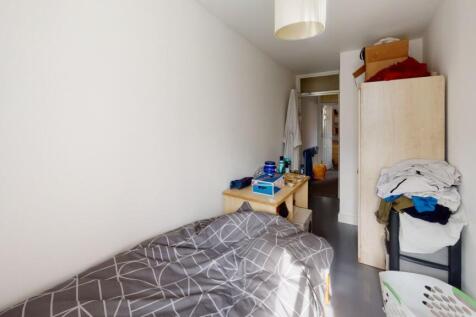 A compact, bright single bedroom featuring a ne...