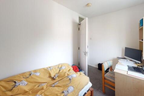 A compact single bedroom featuring a cozy singl...