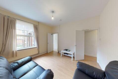 Bright and inviting living room with ample natu...