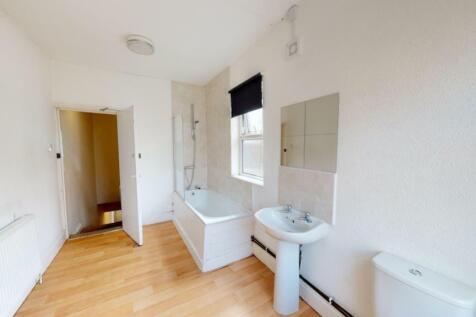 Bright and clean bathroom featuring a full-size...