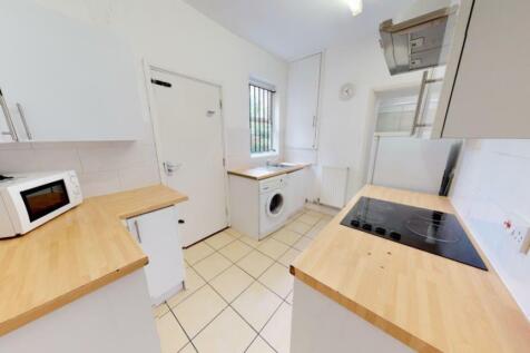 Bright and clean kitchen featuring modern appli...